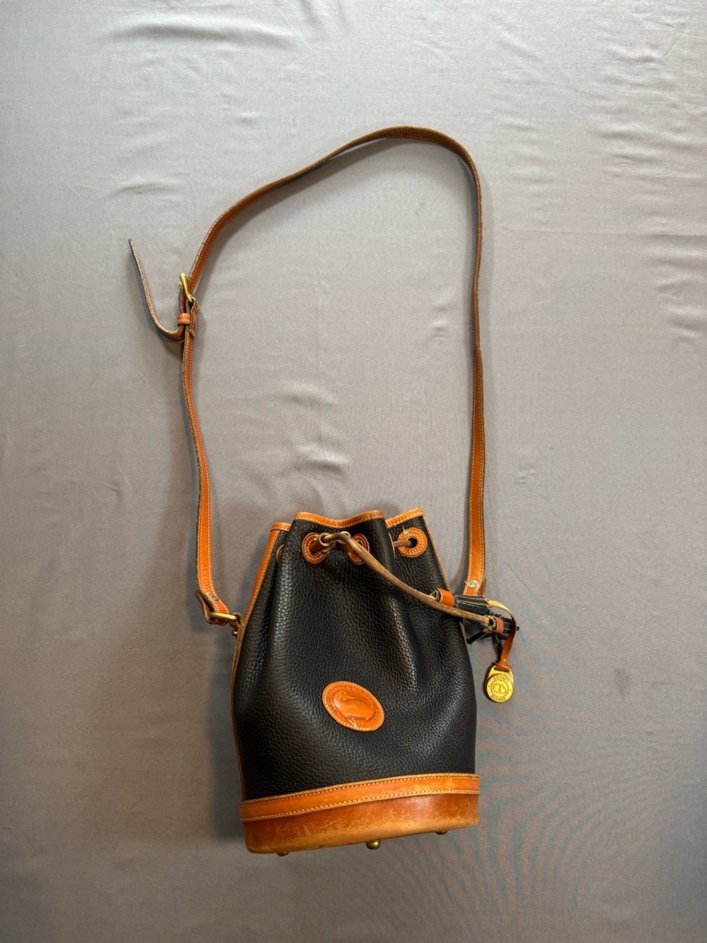Dooney & Bourke Vintage AWL Bucket Bag Black Tan Leather Quiet Luxury